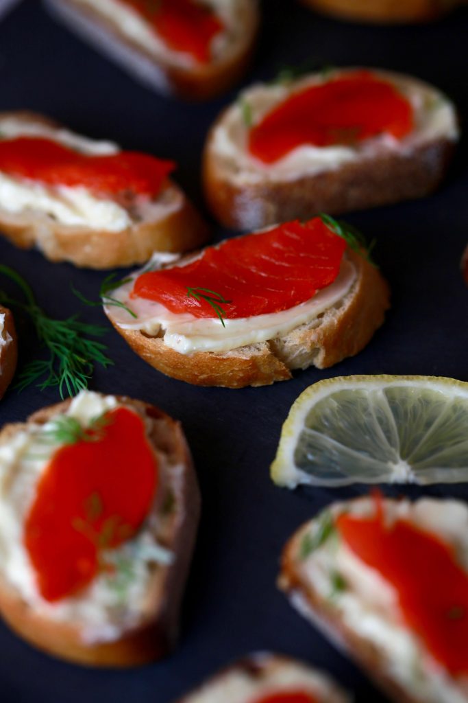 Smoked salmon crostini bites with mustard butter and dill