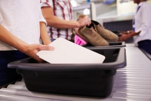 Airport security bins are dirtier than toilets, study shows