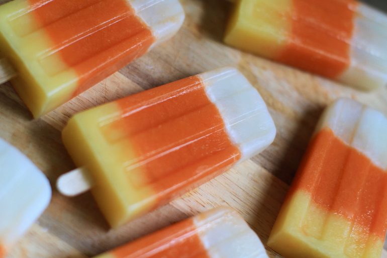 Healthy candy corn popsicles are a perfect Halloween sweet treat.